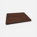 Wooden cutting board on a white background
