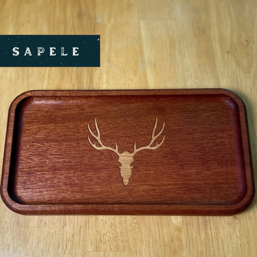 Wooden tray with deer head engraving on a wooden surface, branded 'Sapele'.