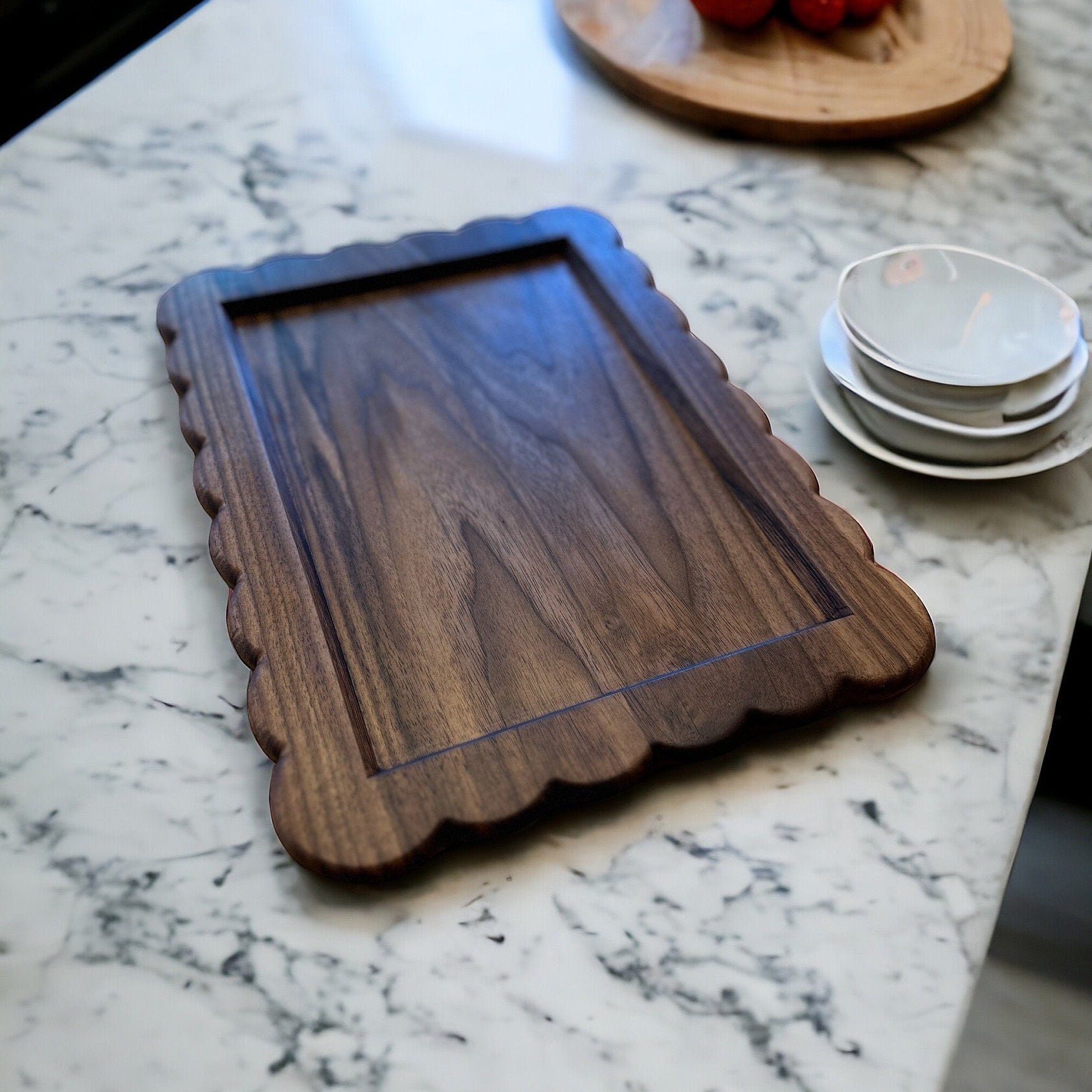 Wooden tray on a marble countertop with a blurred background
