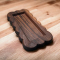 Small scalloped tray on a wooden surface