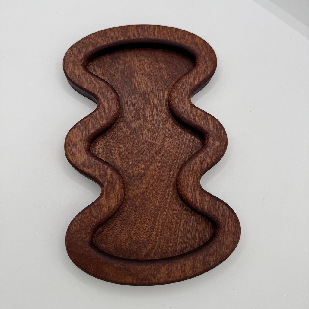 Wooden wavy tray on a white background
